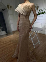 Champagne Radiance Crystal Mermaid Gown With Architectural Satin Drapery And Starburst Bodice