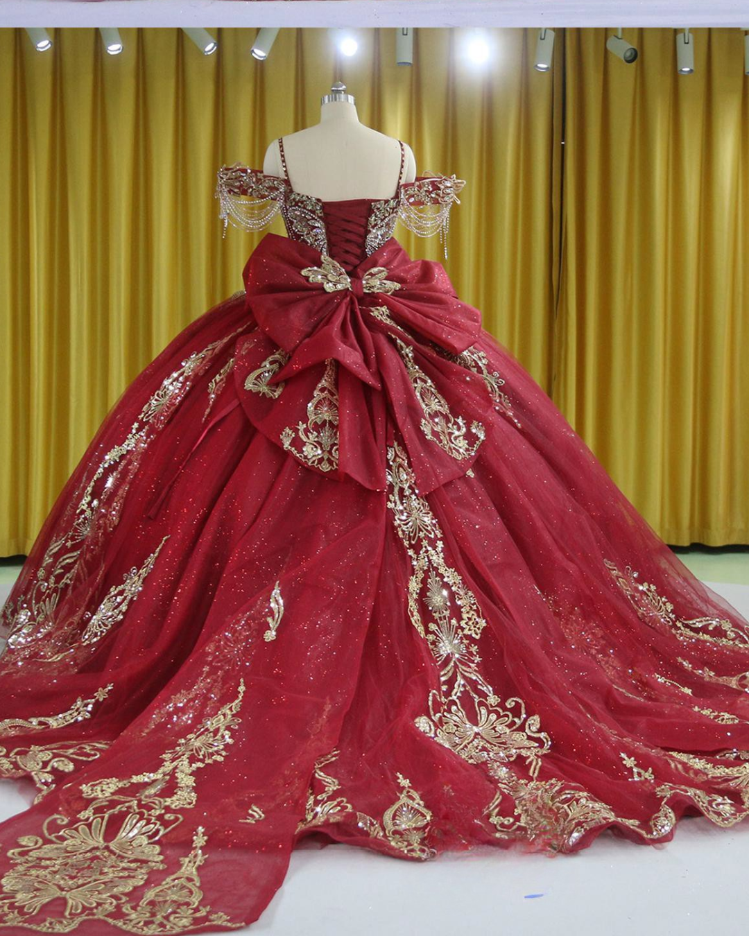 Burgundy Quinceañera Dress With Crystal Tassels, Spaghetti Straps And Corset Bodice